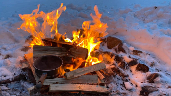 Fire cooking outdoors